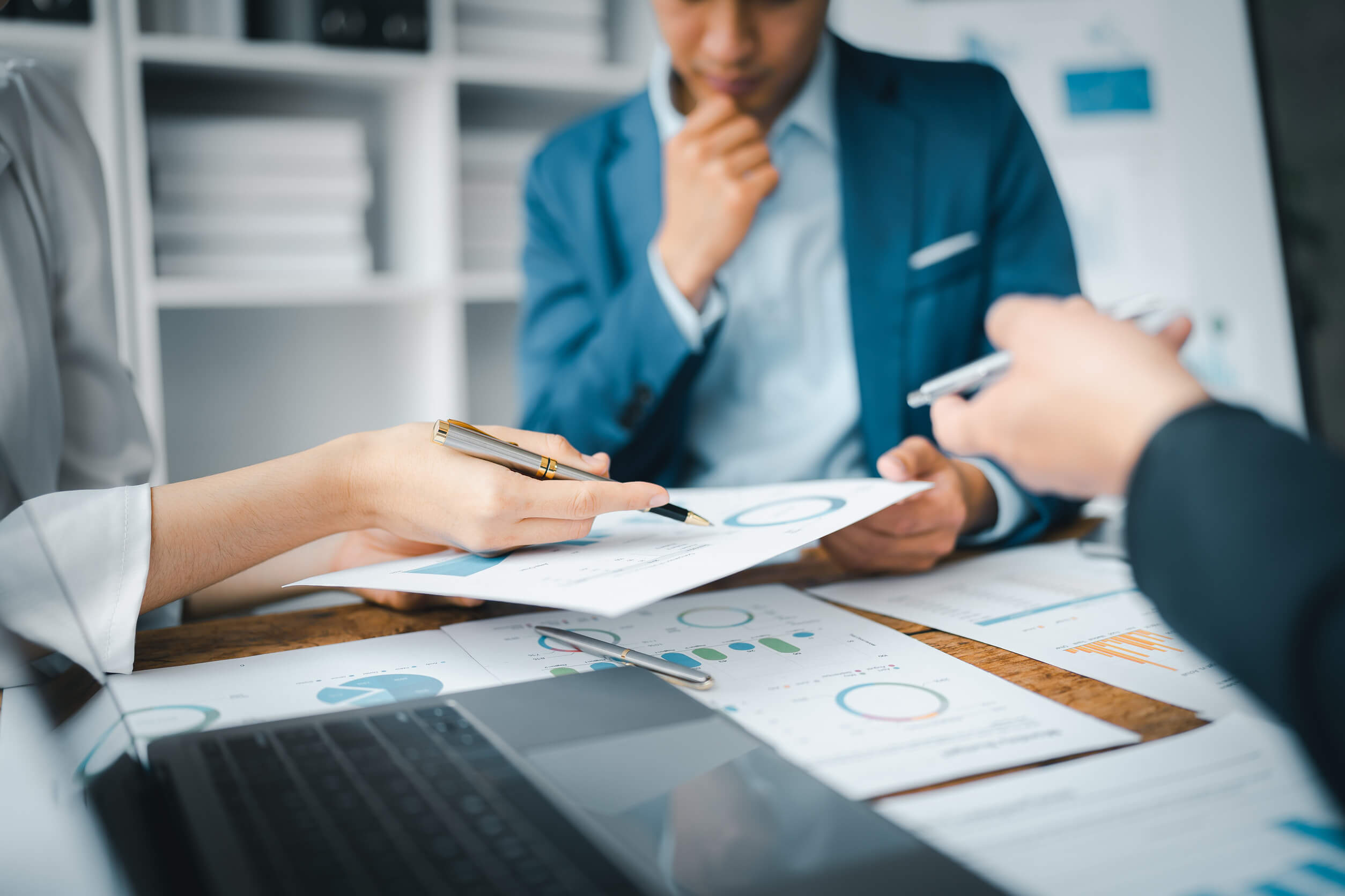 Team reviewing financials in an office.