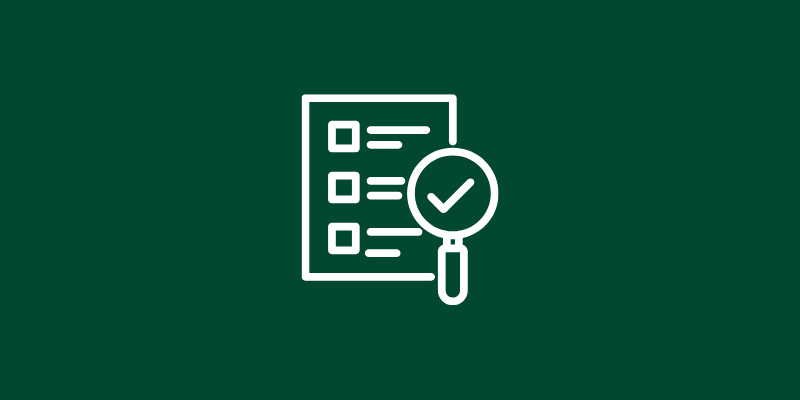 Checklist with magnifying glass icon