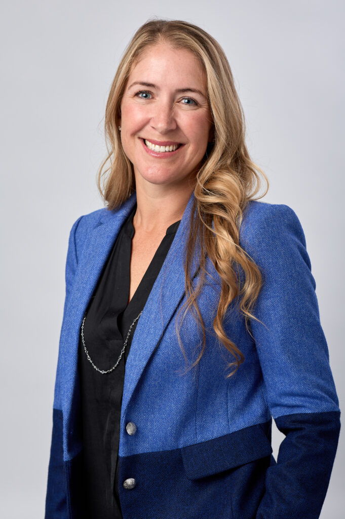 Smiling woman in blue blazer portrait
